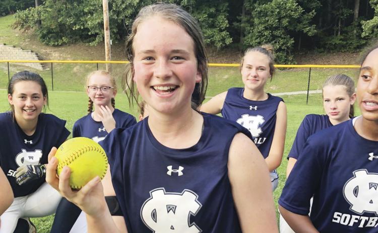 Gabby Whiddon shows off the ball after hitting a game-winning home run in the win over Union County last week. (Photo/WCMS Athletics)