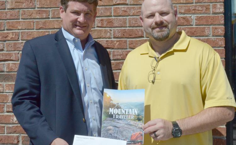 Community Newspapers Inc. Regional Publisher Alan NeSmith (left) presents Joe Gralton of Cleveland with the $100 prize for winning the cover photo contest for fall 2019 edition of The Mountain Traveler. (Photo/Stephanie Hill)