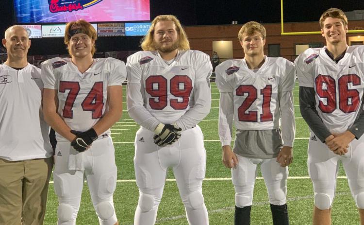 The White County High School football program was well-represented at the Fellowship of Chrisian Athletes East-West All-Star Classic Monday night at North Hall High School. The group consisted of, from left, offensive coordinator Chad Bennett, seniors Cameron Sizemore, Jacob Anderson, Jesse Thomas, and Clay Bolton. The WCHS players were part of the  East team, which dropped a 10-7 decision to the West squad. (Photo/White County FCA)
