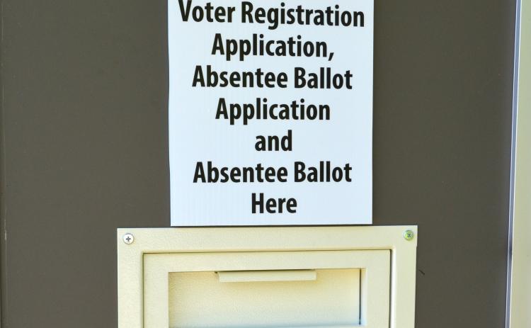 Pictured is the box on the back door at the voter registrar office where residents can drop off their ballots and ballot application. (Photo/Stephanie Hill)