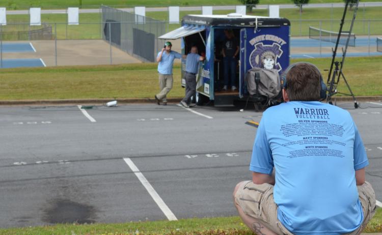White County High School Assistant Principal Adam Wiley looks at a video production truck in the school parking lot where a “drive-in” graduation ceremony will be held this Friday due to restrictions related to the COVID-19 pandemic. The event will also feature a screen for video and a live broadcast. (Photo/Stephanie Hill)