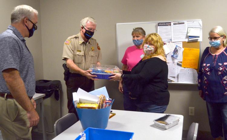From left, White County sheriff-elect Rick Kelley and Sheriff Neal Walden accept gift baskets and treats from Ann Helms, Yvette Sindell and Sharon Worrell, who are part of a Mountain Lakes Chapel effort to show appreciation to local law enforcement. (Photo/Wayne Hardy)