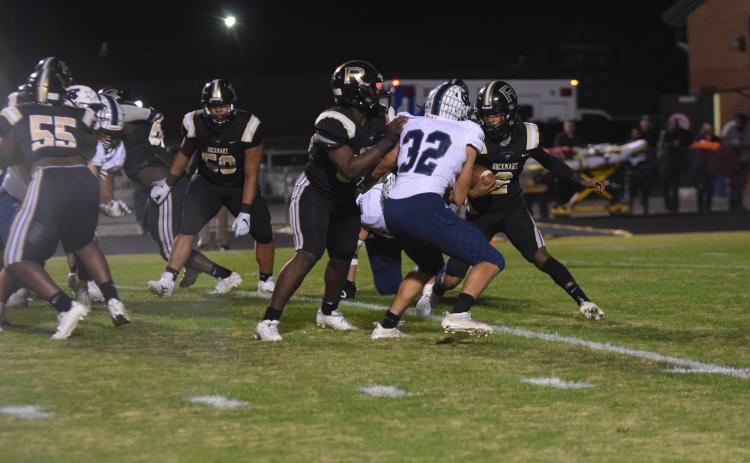 White County's Reece Dockery, No. 32, comes up to tackle Rockmart quarterback Javin Whatley during the opeing drive of the game. 