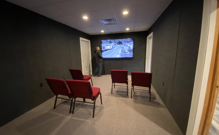 Above, David Greear watches a video he produced telling about the history of Helen. The presentation is part of a new theater room at the Helen Arts & Heritage Center. (Photos/Stephanie Hill)