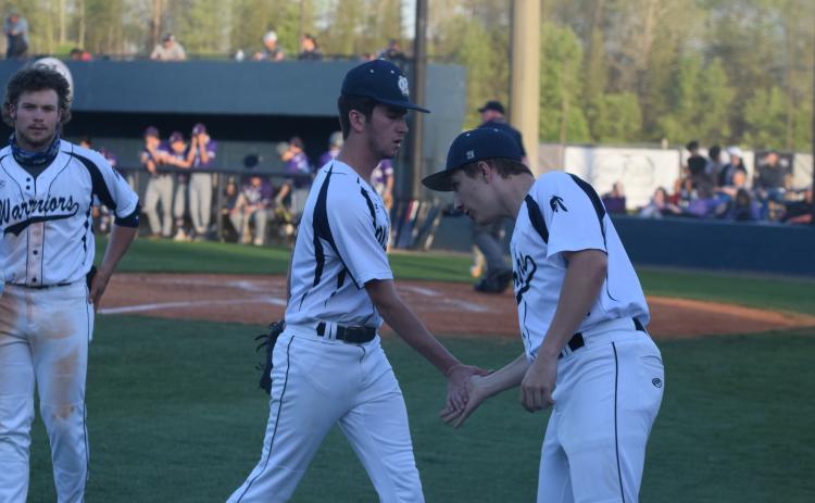 Jacob Matthewson, right, congratulates Caleb Reddy as he walks off the field following the fifth inning of the win over Cherokee Bluff. (Photos/Mark Turner)