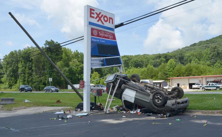One person has been charged after hitting an Exxon Gas Station sign on Wednesday, July 14. (Photo/Stephanie Hill)