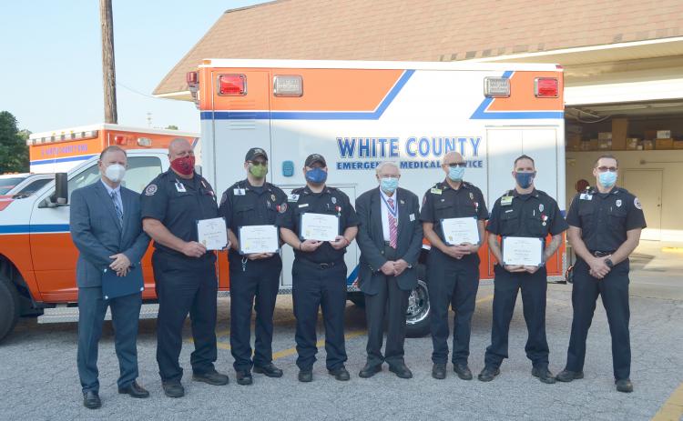 Shown from left are Northeast Georgia Medical Center Emergency Medical Transportation Director Scott Masters, paramedics Jason Meaders, Ben Dills and Andy Turk, Ron Hill, president of the Joseph Habersham Chapter – Sons of the American Revolution, paramedic Rondal Robinson, EMT Robert Rhodes and White County EMS Director Bill Scandrett. (Photo/Wayne Hardy)
