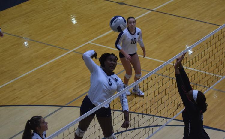 Rusty Dye rises up for a kill during the Lady Warriors' win over Stephens County last Thursday in Cleveland. (Photo/Mark Turner)