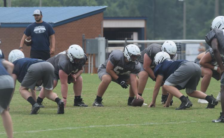 WCHS center Trenton O'Kelly, above, and the Warriors head to East Forsyth Friday for a preseason scrimmage with the Broncos. (Photo/Mark Turner)