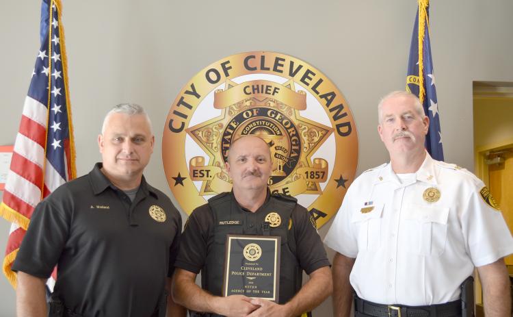 The Cleveland Police Department’s Maj. Aaron Weiland, officer Ray Rutledge and Chief Jeff Shoemaker are shown with the Agency of the Year award. (Photo/Stephanie Hill)