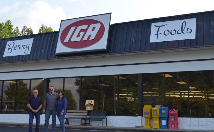 From left, Greg Adams stands with new owners of the IGA grocery store in Cleveland, Steve and Dana Berry. The former Adams Foods IGA was officially sold Sept. 1 and has been renamed Berry Foods IGA. (Photo/Stephanie Hill)