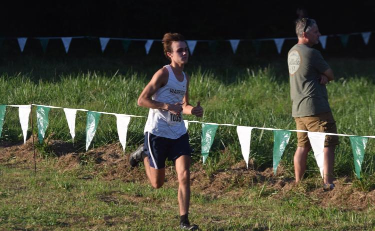 Lance Kelley was one of the top runners for the Warrior cross country teams during the Warpath Invitational  in Canton. (Photos/Mark  Turner)