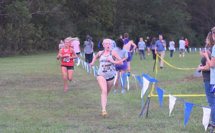 White County's Nealeigh Broadwell, right, pulls away from Rabun County's Molly Jo Wright during the final sprint to the finish line Tuesday at the Mountain Invitational at Unicoi State Park. (Photo/Mark Turner)