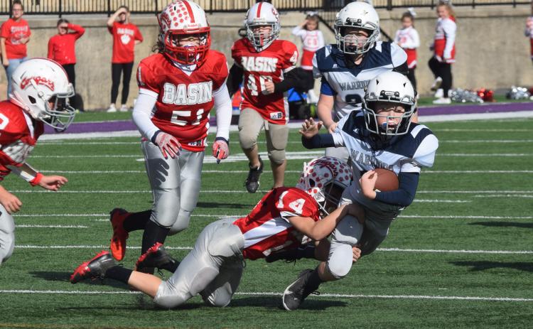 White County's John Jarrard is brought down by a Copper Basin defender during the Mountain Athletic Conference's fifth-grade semifinal game last weekend at Lumpkin County High School. (Photo/Mark Turner)