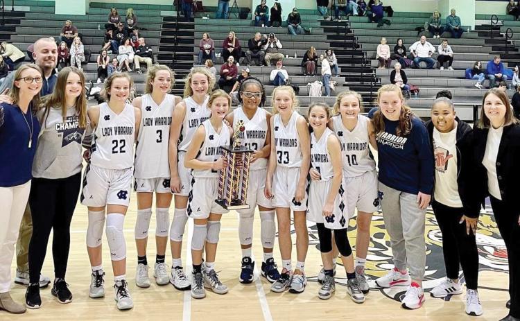 The White County Middle School seventh-grade teams shows off some championship hardware after winning the North Georgia Mountain League title last week in Ellijay. (Photo/WCMS Athletics)