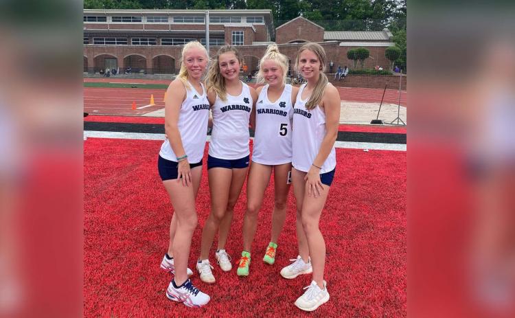 The Lady Warriors' 4x800-meter of, from left, Reese Vandegriff, Emma Lightsey, Nealeigh Broadwell, and Rachel Carter set a school record in the event during the sectional meet in Norcross. 