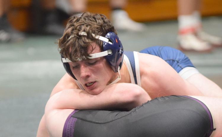 Christian Keheley, top, and the Warriors head into Saturday's tournament looking to win their second straight 7-AAA Area Duals championship. (Photo/Mark Turner)