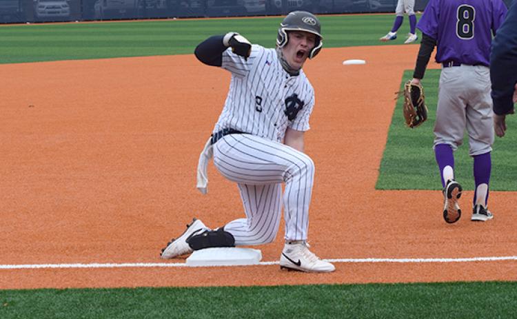Mason Gee reacts after sliding into third base with a two-run triple during the Warriors' win over Union County last Saturday. (Photo/Mark Turner)