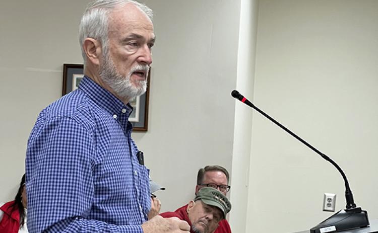 Larry Adams explains plans for a 47-unit subdivision on Claude Sims Road to the White County Commission. (Photo/Linda Erbele)