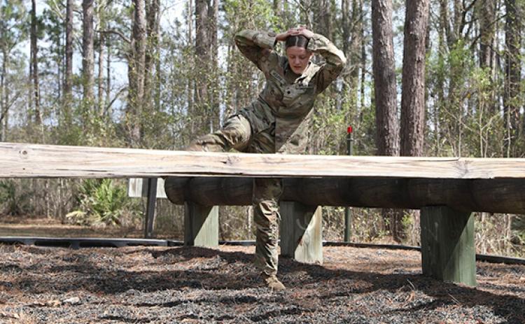 Victoria McDuffie works her way through an obstacle course during the Georgia Army National Guard 2023 State Best Warrior competition earlier this month in Fort Stewart. (Photo/US Army)