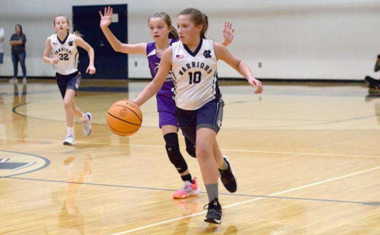 Ansleigh Vandiverdr dribbles by a Union County defender during the Class C 12U state championship game last Saturday at White County High School.  (Photo/Mark Turner)