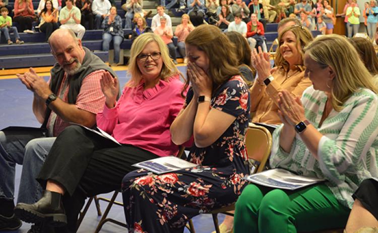 White County School System Teacher of the Year Holly Witcher places her head in her hands as fellow school honorees Brad Abernathy, Tina Vandiver and Meredith McConnell congratulate her. (Photos/Samantha Sinclair)
