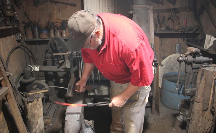 Greg Petitt works in his blacksmith shop behind his chiropractic office on Kytle Street. (Photo/Jessica Wood)