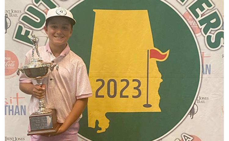 Hudson Justus shows off the hardware after finishing second at the Future Masters tournament in June. (Photo/Submitted)