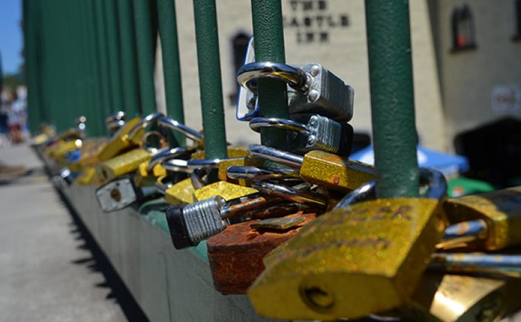 Love locks have been adding thousands of pounds of extra weight to the bridge over the Chattahoochee River. (file photo)