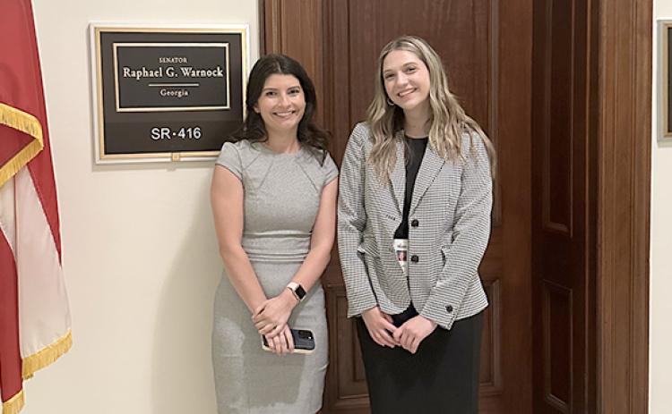 Leah Smith, right, stands with Elena Radding, Sen. Raphael Warnock’s press secretary, outside the senator’s office on Capitol Hill. (Photo/submitted)