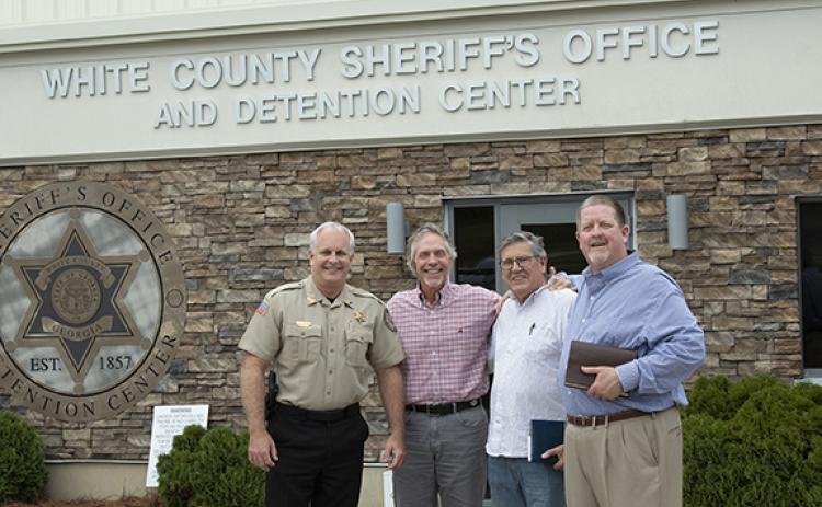 White County Sheriff Rick Kelley, Lead Pastor Jim Holmes, Chaplain Vic Bedzyk and Associate Pastor Steve Smith from Helen First Baptist in front of the White County Sheriff’s Office where the weekly jail ministry is held. (Photo/Noah Johnson)