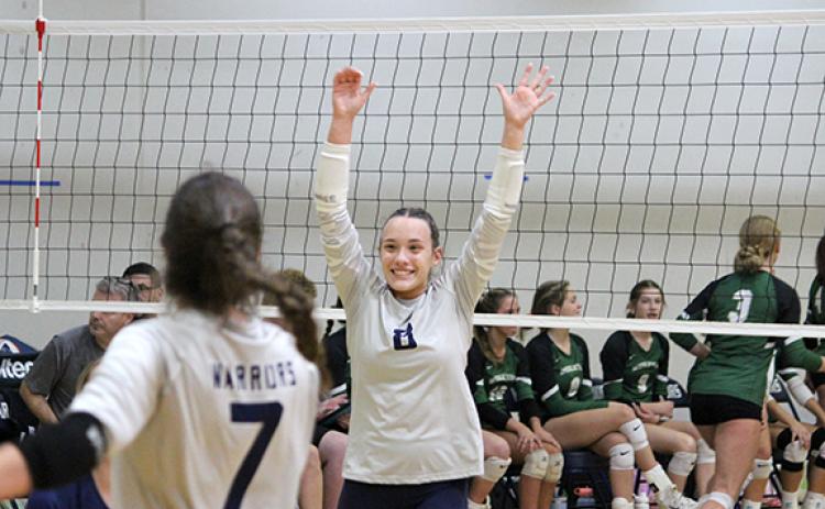 Kate Blair celebrates a point during the second set of the area win Tuesday over Wesleyan. (Photo/Mark Turner)