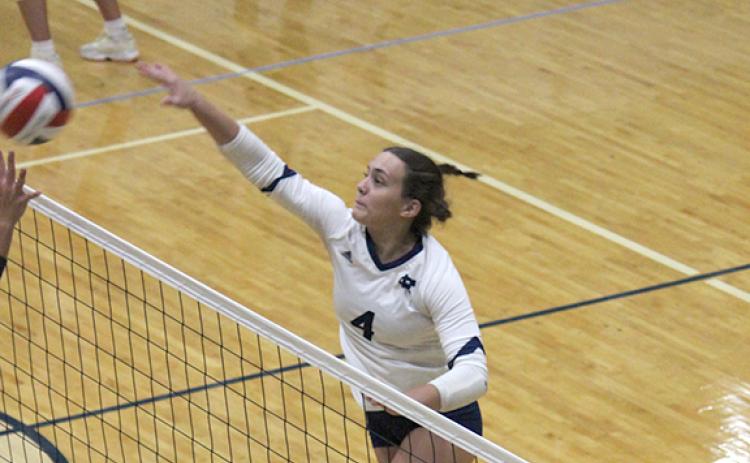 Maggie Blair hammers a shot at the net during the win Tuesday over Union County. (Photo/Mark Turner)