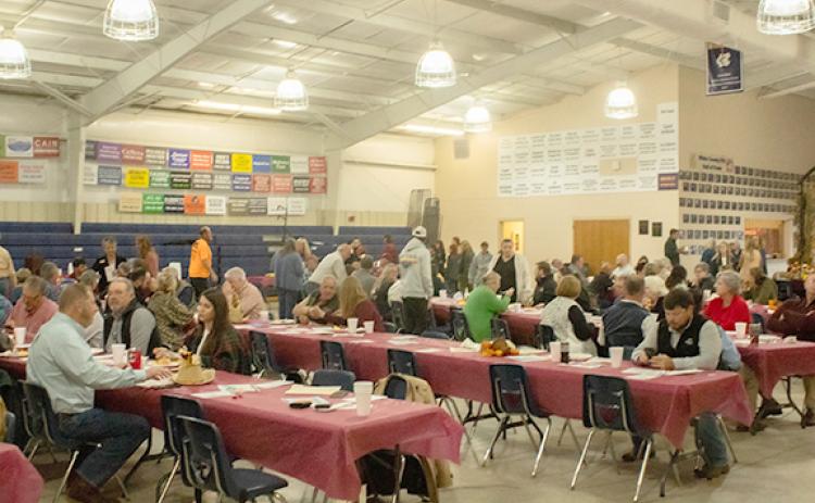 Guests take their seats after getting breakfast at the 20th Annual Farm City Week Breakfast. (Photo/Noah Johnson)