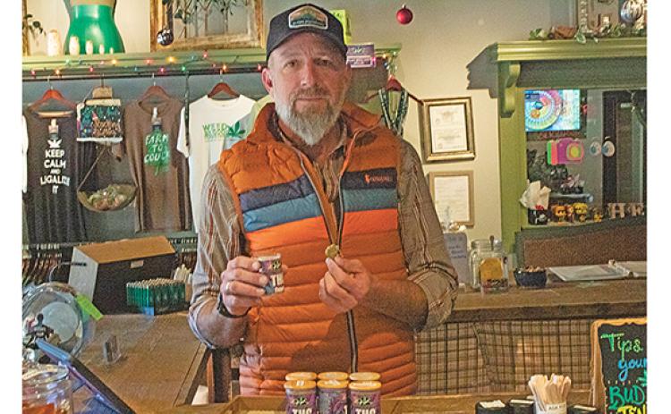 Owner and operator of Alpine Dispensary, Josh Garrison shows products in his express location in downtown Helen. (Photo/Noah Johnson)