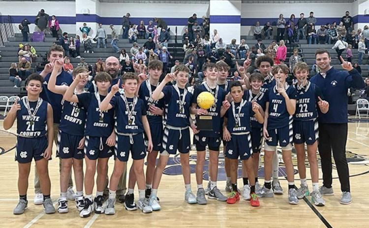 The WCMS Warriors show off the tournament hardware after winning the North Georgia Mountain League seventh grade title last week in Ellijay. The Warriors finished the season with a 16-4 record. (Photo/WCMS Athletcis)