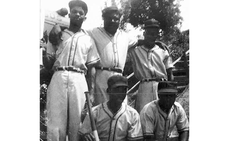 An old photo of some members of the Valley Vets baseball team, which played in the Bean Creek Community. In front are Jesse James Nicely and Jackson Nicely. Standing behind them are Calvin Nicely, William “Big Moon” Lowery and R.T. Trammell. (Photo courtesy Caroline Crittenton on behalf of the Bean Creek Alliance for the Pictorial History of White County, Georgia)