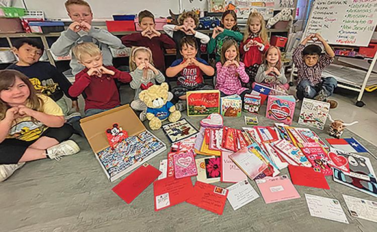 Kindergarten students at Mossy Creek Elementary School show their love for the valentines they received from around the world. (Photo/submitted)