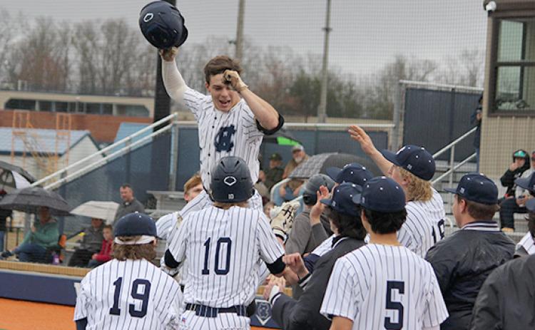 Ryan Fowler, above, got the matchup started with a two-run home run in the first inning of the opening game and then celebrated with his teammates. (Photo/Mark Turner)
