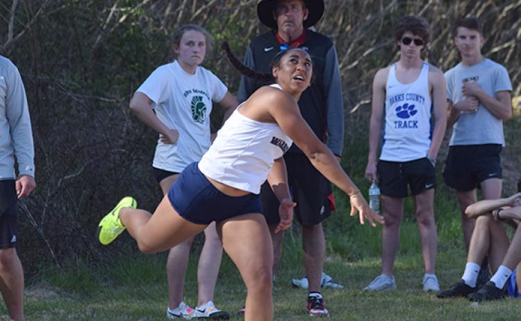 Yvonne Minutello finished fourth in the shot put. (Photos/Mark Turner)