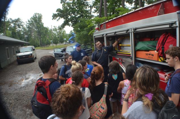 Josh Eaton and Capt. Jason Ravan of White County Fire Station 6 do the same for their fire truck.