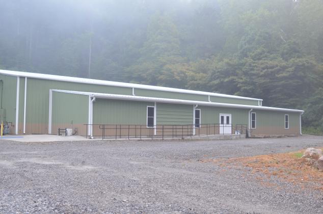 The roughly 12,000-square-foot building, formerly with a red façade, has been repainted with the green, brown and white color scheme of Mountain Education Charter High School. More interior renovation is planned.