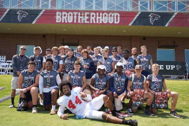 Members of the White County football team pose with Atlanta Falcons' linebacker Vic Beasley after practice last Saturday at the team's complex in Flowery Branch.