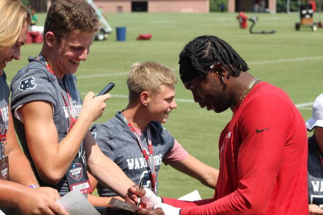WCHS players, from left, Jacob Anderson, Jimmy King and Nix Burkett share a laugh with the Falcons' All-Pro receiver Julio Jones.