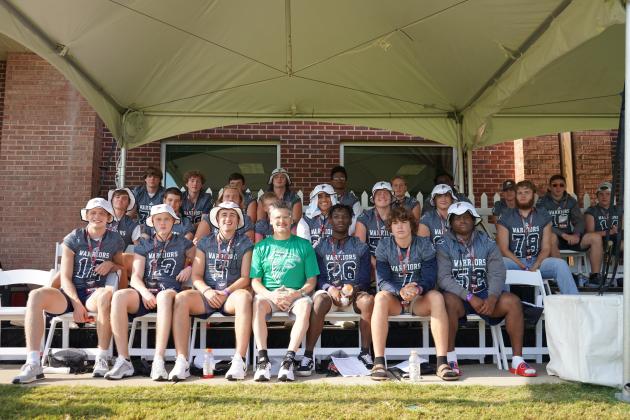 Atlanta Falcons' general manager Thomas Dimitroff, front row, center, spoke to the WCHS players during the practice session at the team's facility in Flowery Branch.