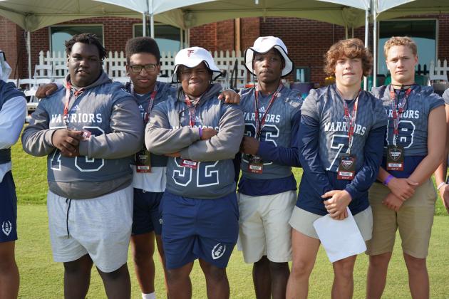Heaven Gholston, left, Zion McMullens, Jaquez Williams, Silas Mullgan and Alex Thornton watch a team drill during the Falcons' practice session.