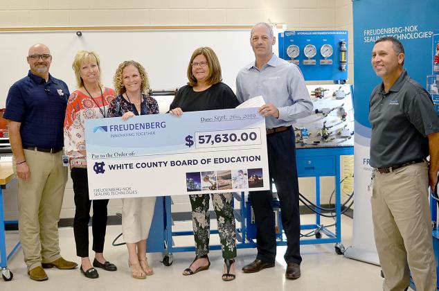 Shown from left are WCHS industrial mechanics teacher Tim Mayo, Assistant Principal Angie Helton, Principal Mary Anne Collier, White County Schools Superintendent Dr. Laurie Burkett, Gary VanWambeke (Freudenberg NOK vice president for Global Lead Center Transmission and Driveline Seals) and Wyman Hare, Cleveland plant manager for Freudenberg NOK. (Photo/Wayne Hardy)
