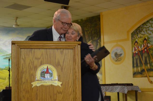 Jeff Ash and Linda Fowler hugged after he presented her with a copy of the proclamation and photos that would be installed at the Hall of Fame. (Photo/Stephanie Hill)