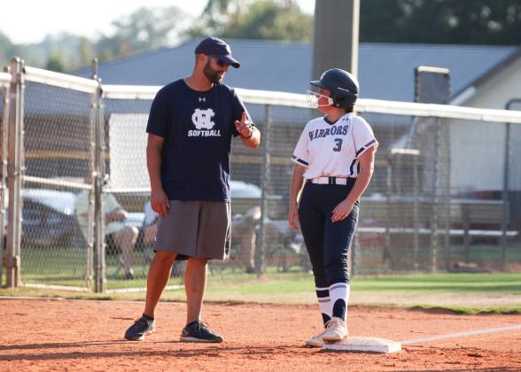 WCHS head coach Drew Owens, left, talks with senior Rachel Brock during the Senior Night win over West Hall. (Photo/Staci Sulhoff)