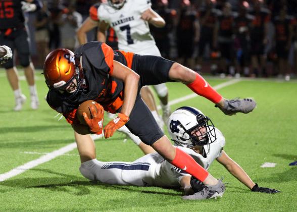 White County's Nix Burkett, trips up Habersham Central's Grayson Taylor during the Raiders' win over the Warriors last Friday night in Mt. Airy. (Photo/Staci Sulhoff)